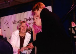 Alison Fielden holds the button as Daisy Cooper and Charlie Cooper switch on Cirencester's Christmas Lights